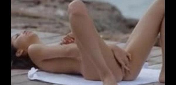  young asian teen masturbates outside by the ocean